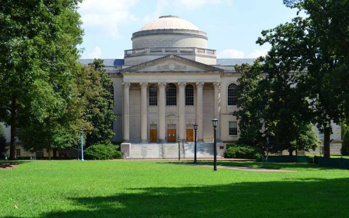 UNC Chapel Hill campus building with students walking University of North Carolina student life and environment